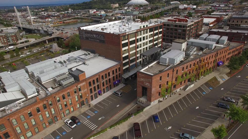 Aerial view of UW Tacoma campus, showing ghost signage on the F.S. Harmon and Mattress Factory buildings. 
