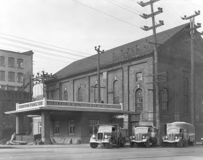Photo from 1937 showing Griffin Fuel Company trucks in front of the Snoqualmie Falls Power Co. Transfer House. 